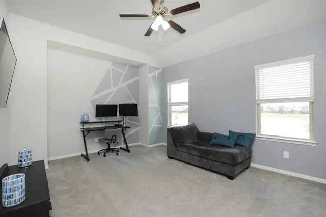 a view of walk in closet with clothes