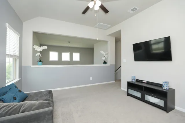a living room with furniture and a window