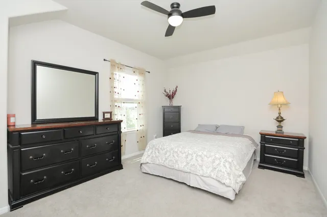 a living room with a flat screen tv and a window