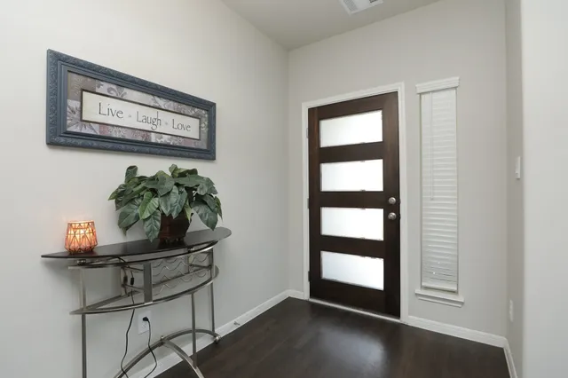 a dining room with furniture and wooden floor