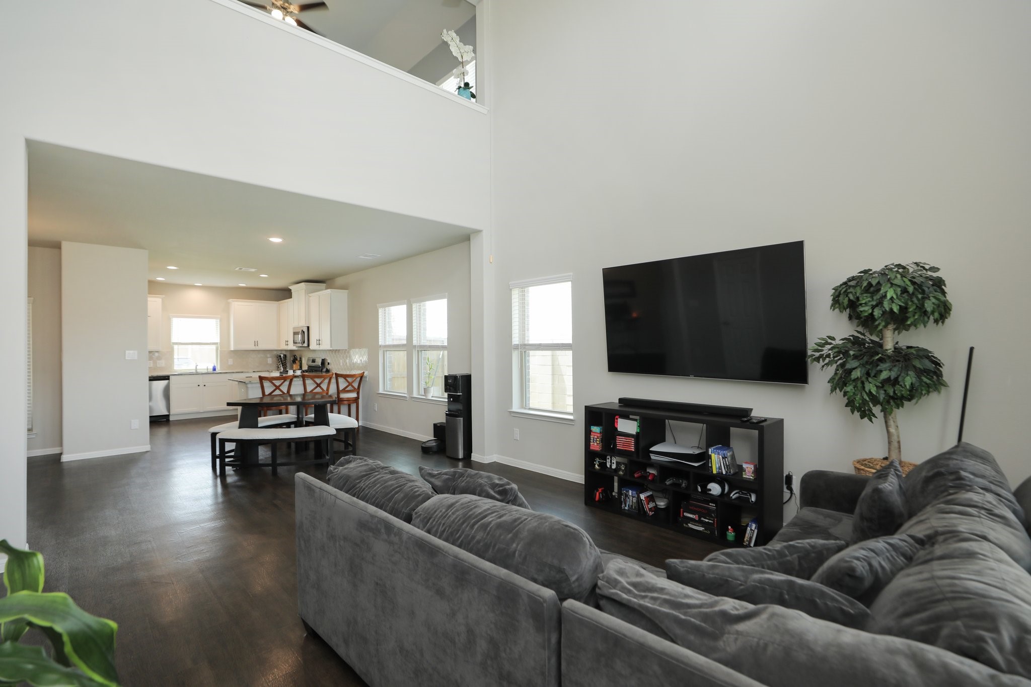 2401 Sequoia Grove Drive Rosharon, TX 77583 - Photo 6 of 39 LIVING/ KITCHEN- This gives a glimpse into the LIGHT FILLED kitchen that has a bar area and open concept dining area (6-8 chairs easily).