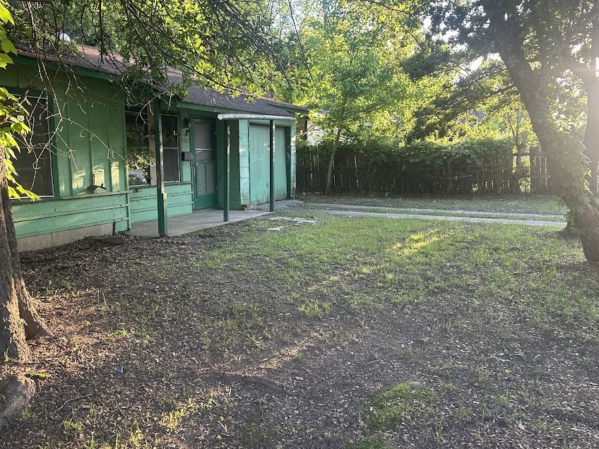 406 Jenkins Street Daingerfield, TX 75638 - Photo 1 of 9 a view of a house with backyard and trees