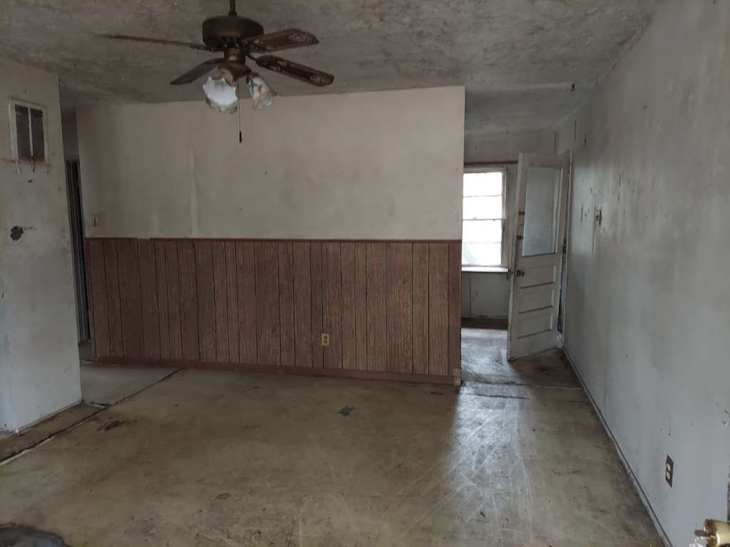 406 Jenkins Street Daingerfield, TX 75638 - Photo 2 of 9 wooden floor in an empty room