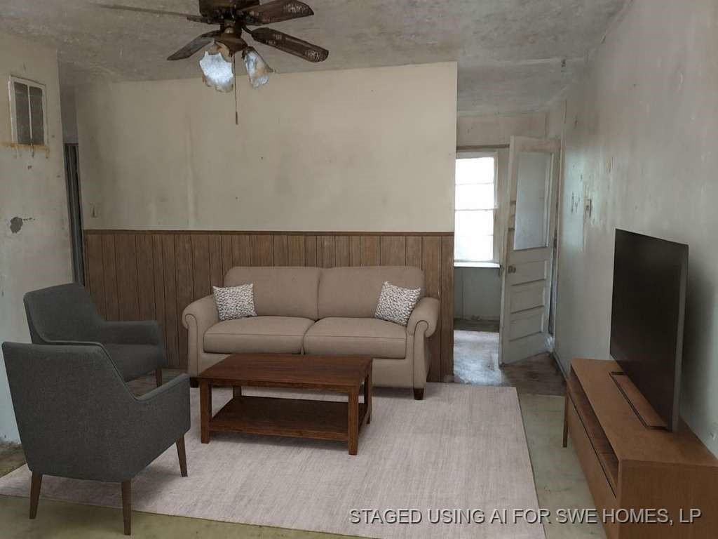 406 Jenkins Street Daingerfield, TX 75638 - Photo 3 of 9 a living room with furniture and a flat screen tv
