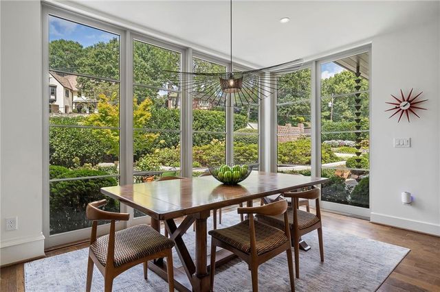 a view of a livingroom with furniture and a bookshelf