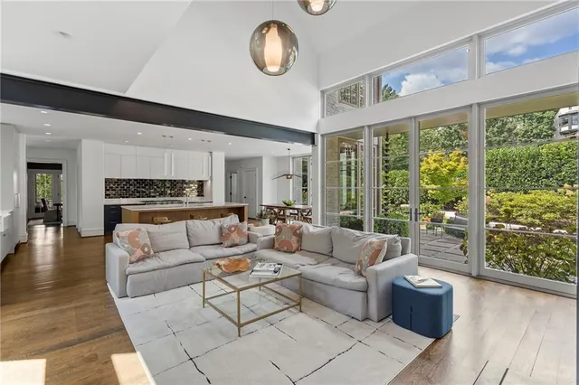 a bathroom with a granite countertop sink mirror and shower