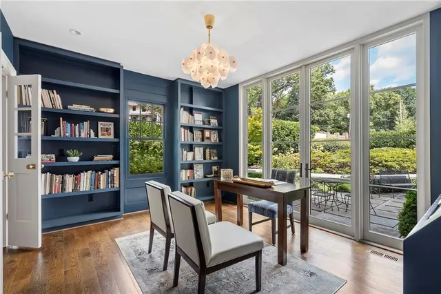 a view of walk in closet with clothes