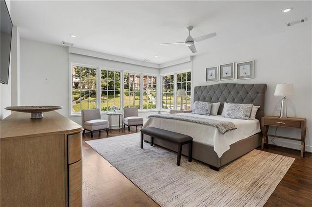 a storage room with wooden floor washer and dryer