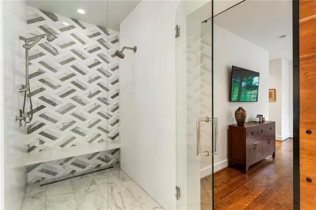a bathroom with a sink toilet and shower