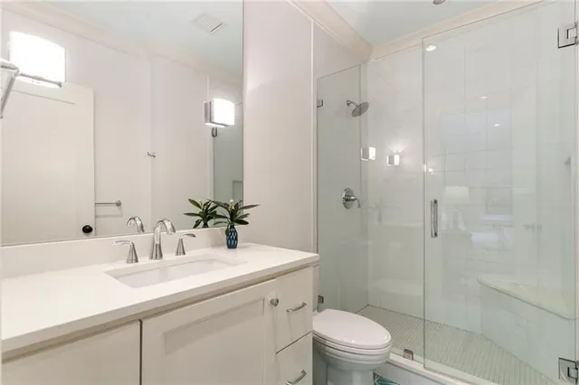 a front view of house and yard with beautiful flowers and green space