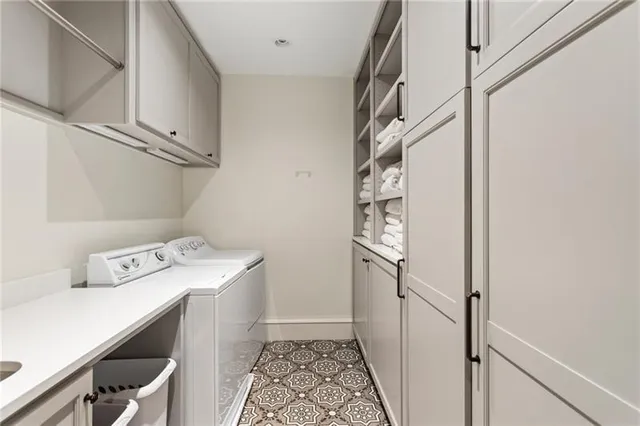 a front view of a house with lots of flowers