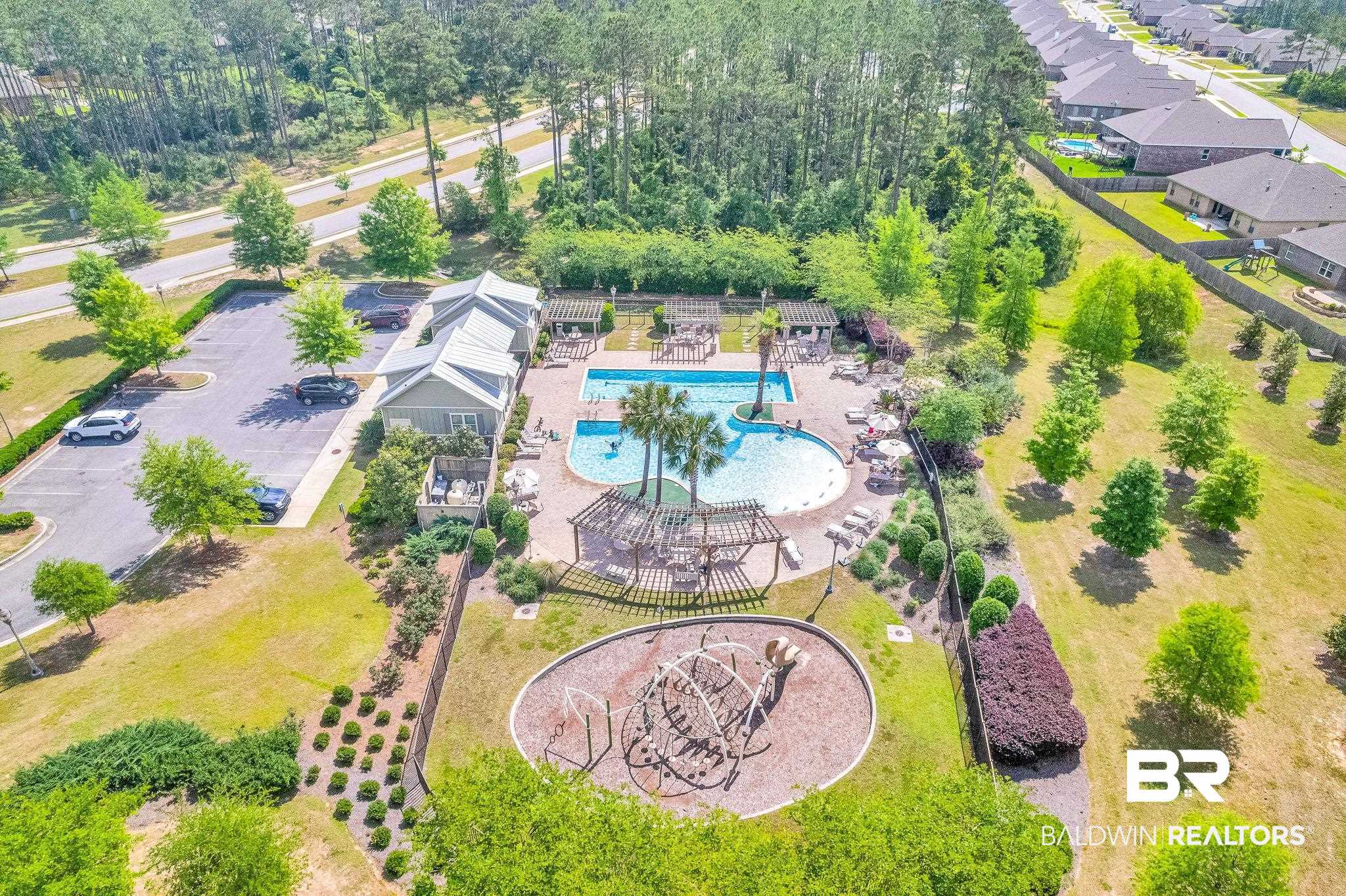 13233 Ibis Boulevard Daphne, AL 36527 - Photo 96 of 100 Community amenity center featuring a swimming pool, covered lounging areas, and a dedicated playground