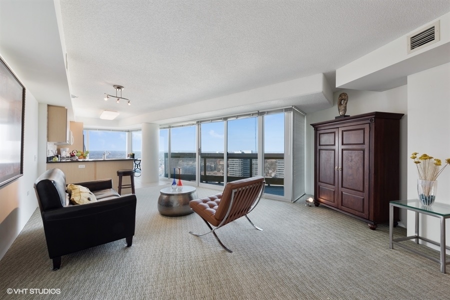1720 Maple Avenue, Unit 2160 Evanston, IL 60201 - Photo 3 of 45 a living room with furniture and a flat screen tv