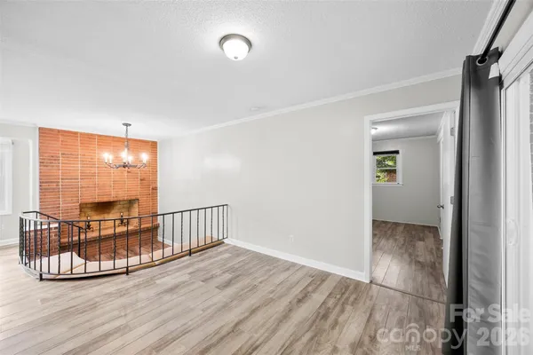 a kitchen with a refrigerator and a stove