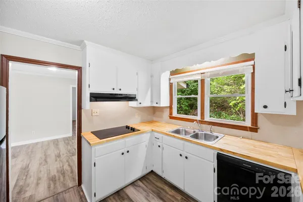 a view of kitchen with wooden floor