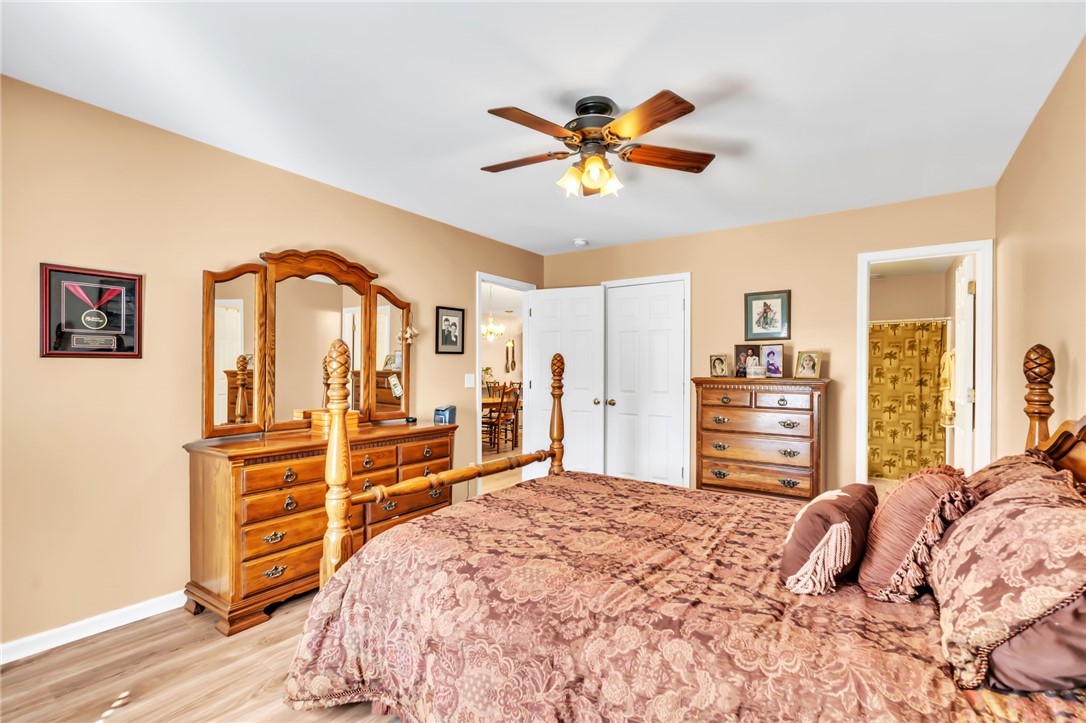 18 Sweetgrass Trail Anderson, SC 29625 - Photo 13 of 26 This spacious bedroom offers comfortable living with elegant finishes and a private attached bathroom.