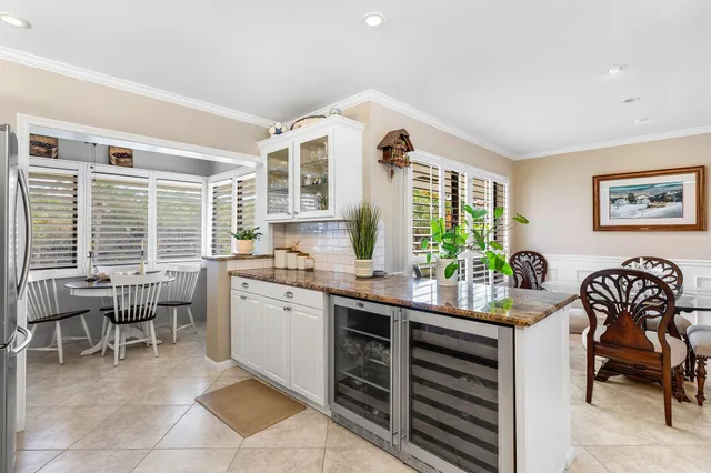 a kitchen with a table chairs and a stove