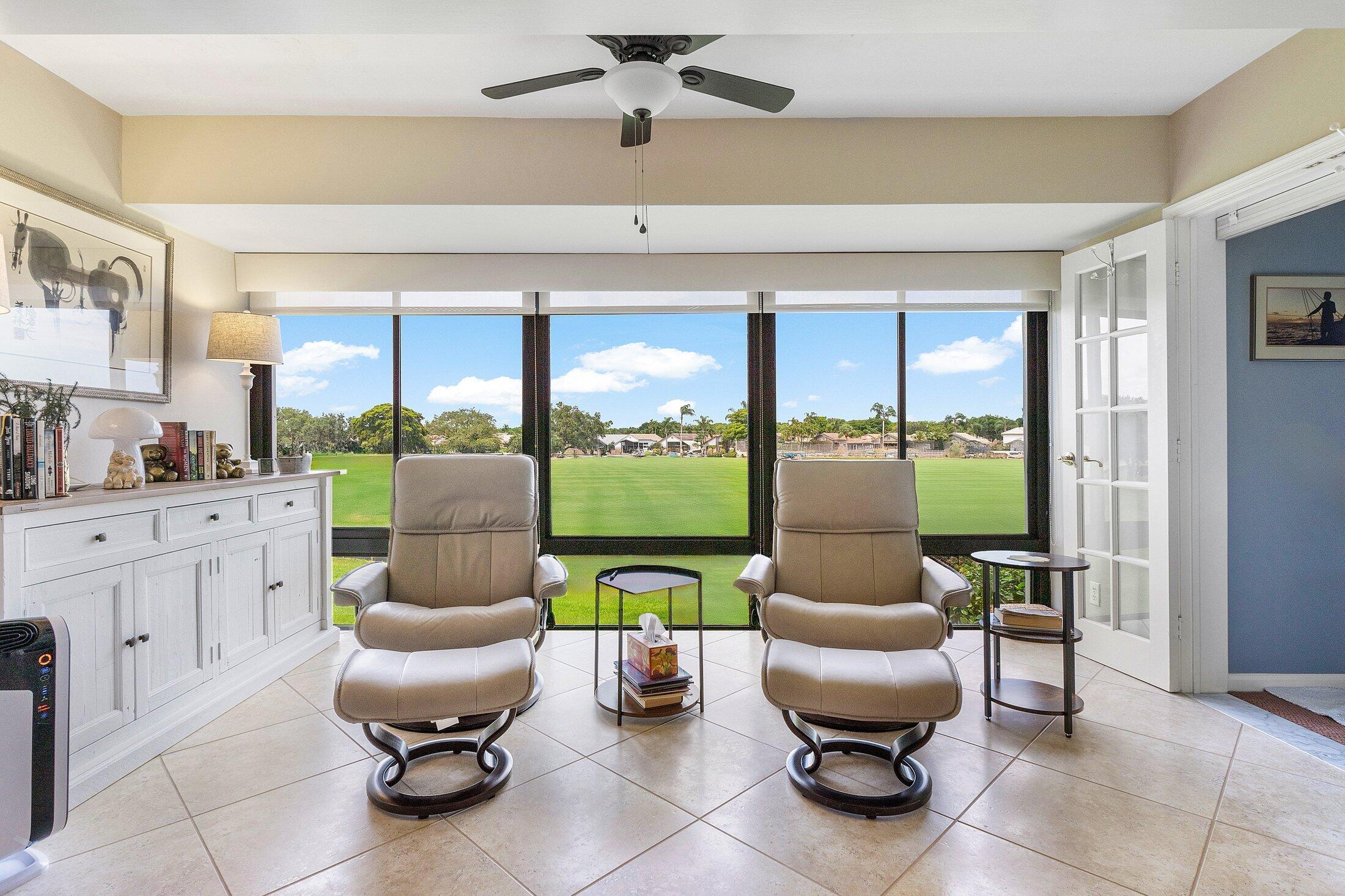 10093 Quail Covey Road, Unit HIBISCUS N Boynton Beach, FL 33436 - Photo 13 of 34 a living room with furniture and a large window