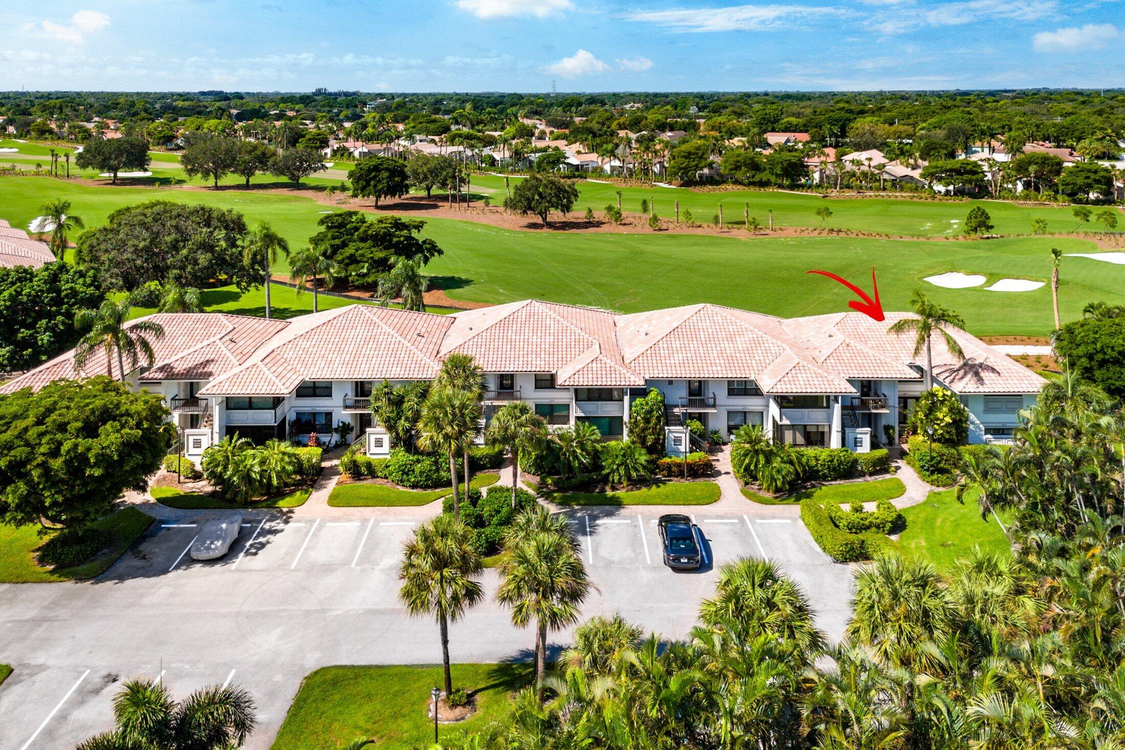 10093 Quail Covey Road, Unit HIBISCUS N Boynton Beach, FL 33436 - Photo 2 of 34 an aerial view of a house with yard swimming pool and outdoor seating