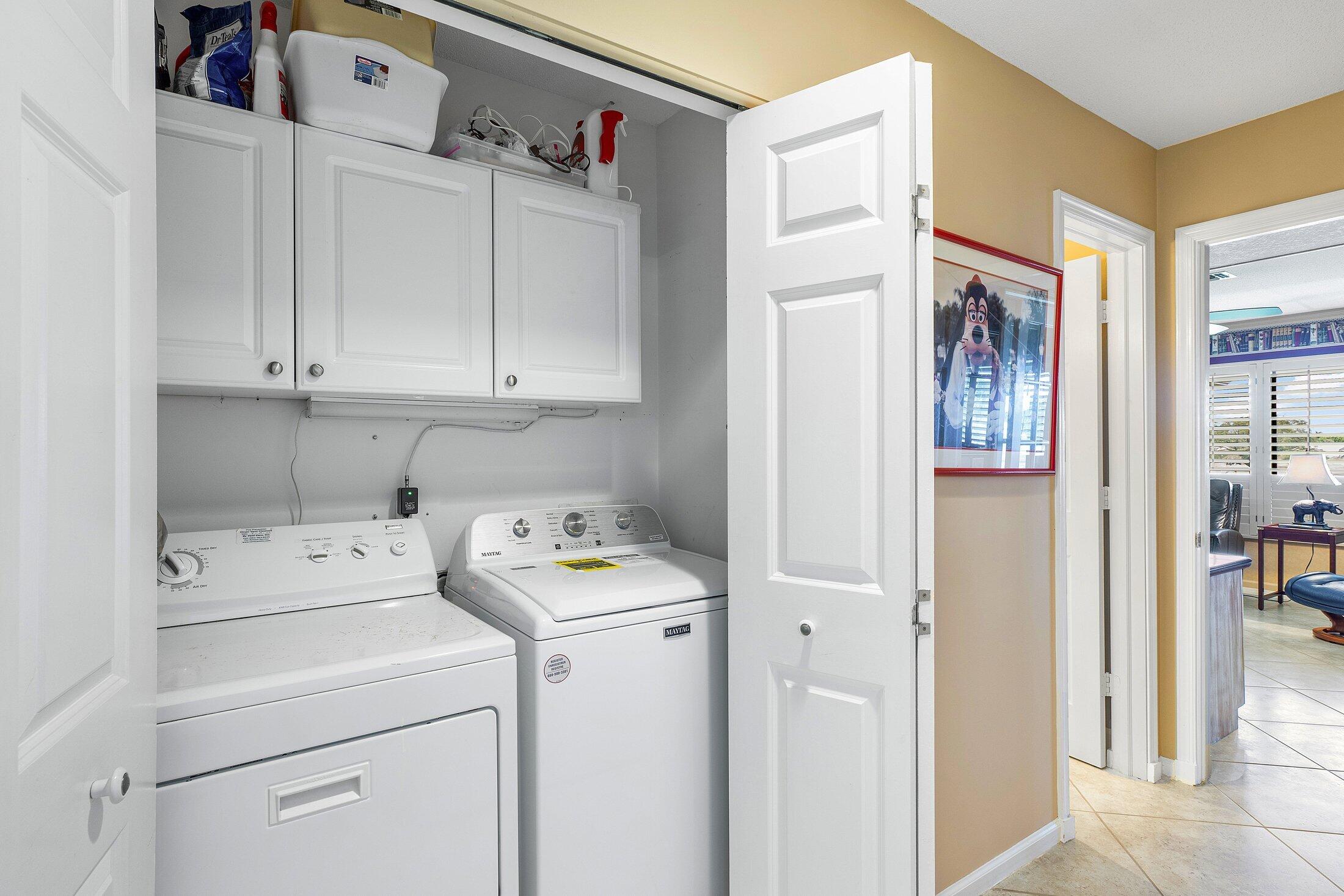 10093 Quail Covey Road, Unit HIBISCUS N Boynton Beach, FL 33436 - Photo 21 of 34 a utility room with dryer and washer