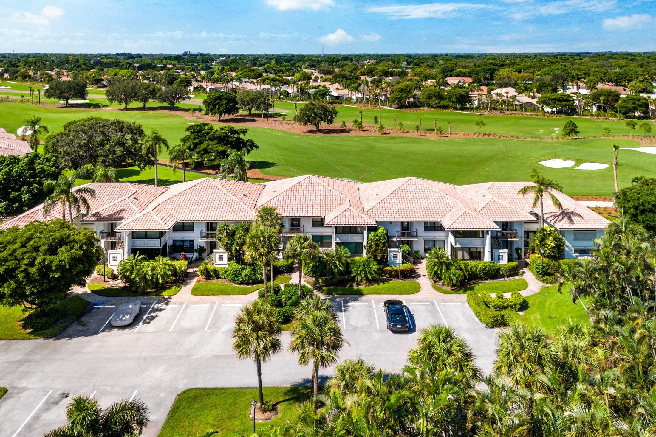 10093 Quail Covey Road, Unit HIBISCUS N Boynton Beach, FL 33436 - Photo 28 of 34 an aerial view of a house with yard swimming pool and outdoor seating