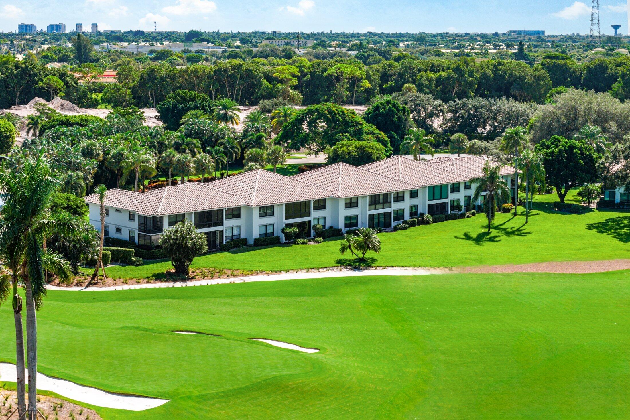 10093 Quail Covey Road, Unit HIBISCUS N Boynton Beach, FL 33436 - Photo 29 of 34 a view of a house with a big yard