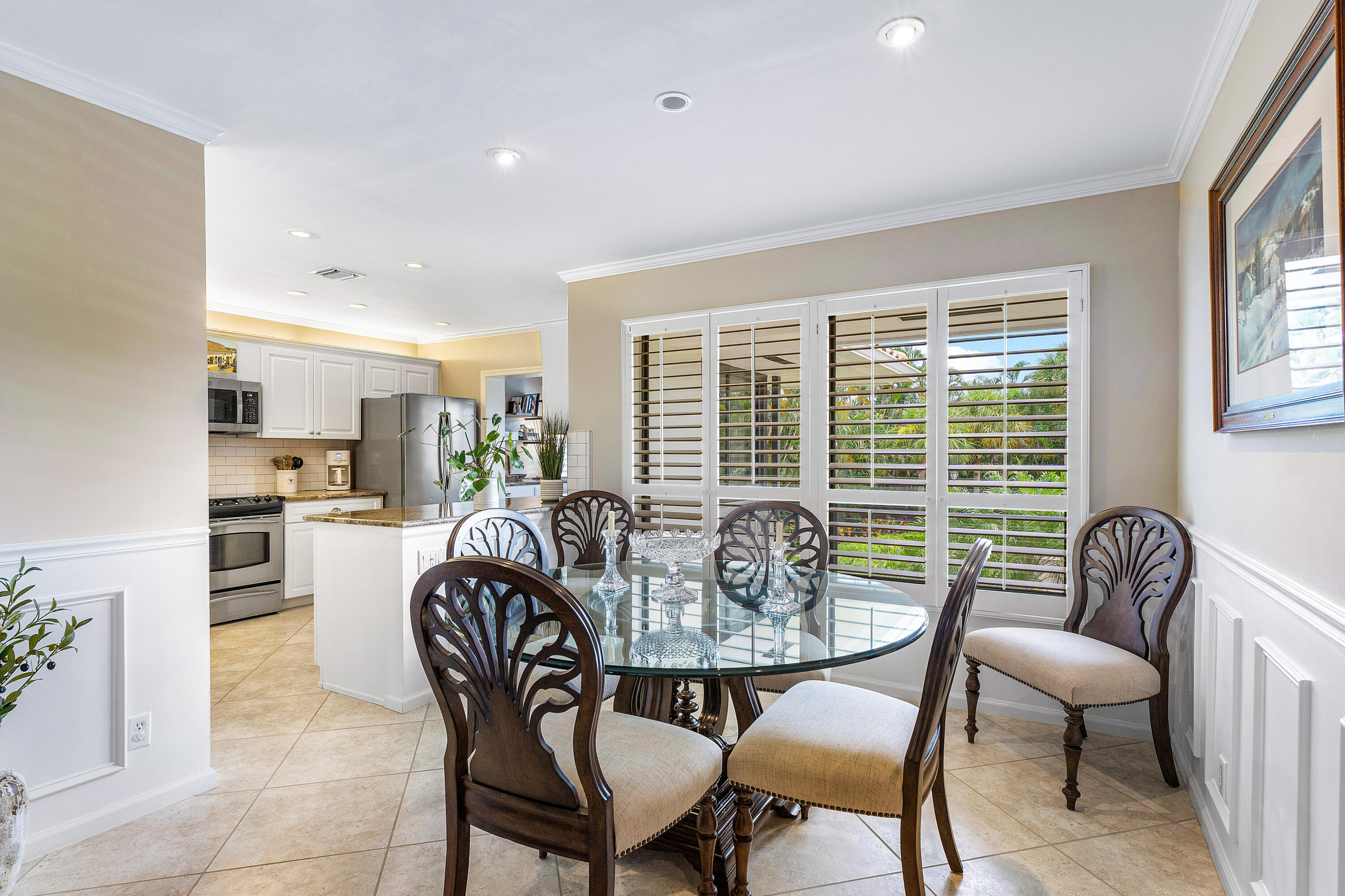10093 Quail Covey Road, Unit HIBISCUS N Boynton Beach, FL 33436 - Photo 6 of 34 a view of a dining room with furniture window and outside view