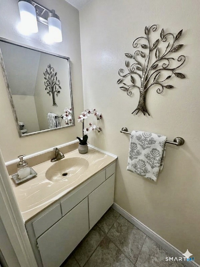 2 Lakeside Drive, Unit M Ledyard, CT 06339 - Photo 15 of 38 a bathroom with a sink and a mirror