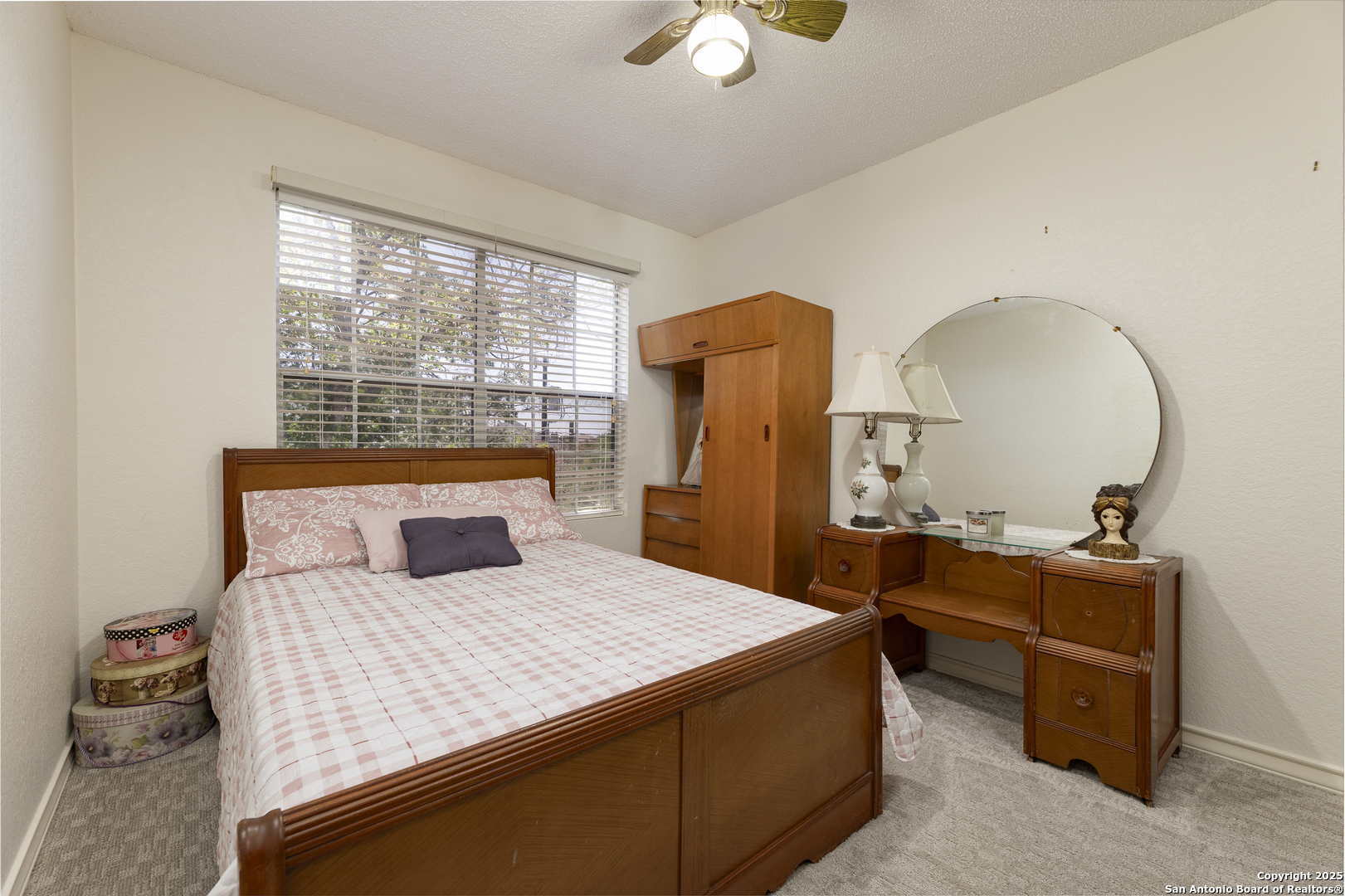 922 Hedgestone Drive San Antonio, TX 78258 - Photo 20 of 40 a bedroom with a bed and a dresser