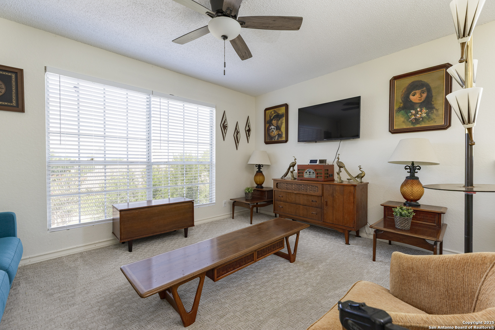 922 Hedgestone Drive San Antonio, TX 78258 - Photo 23 of 40 a living room with furniture and a flat screen tv