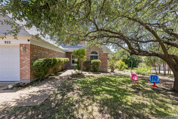 a backyard of a house with large trees