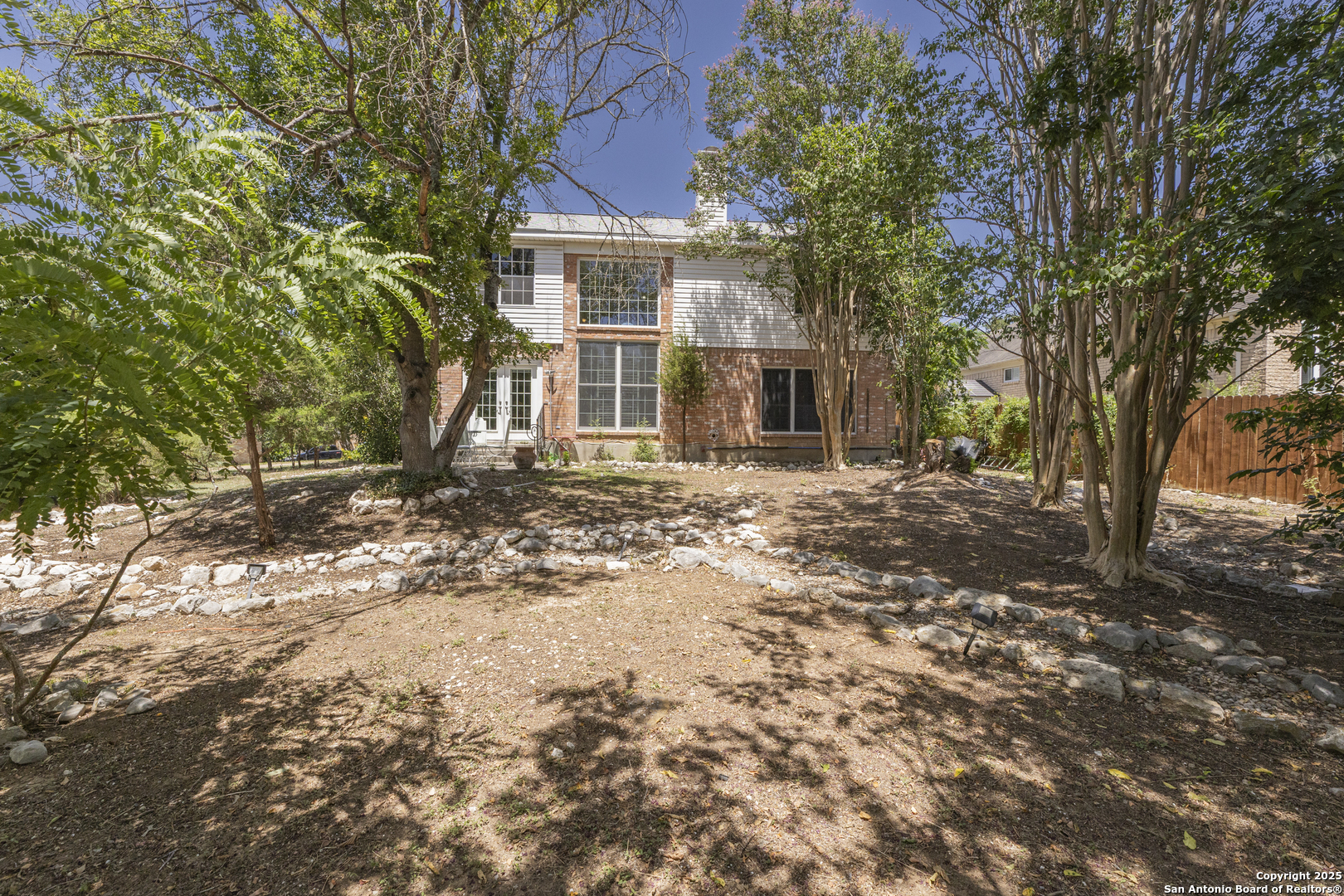 922 Hedgestone Drive San Antonio, TX 78258 - Photo 30 of 40 a front view of a house with a yard