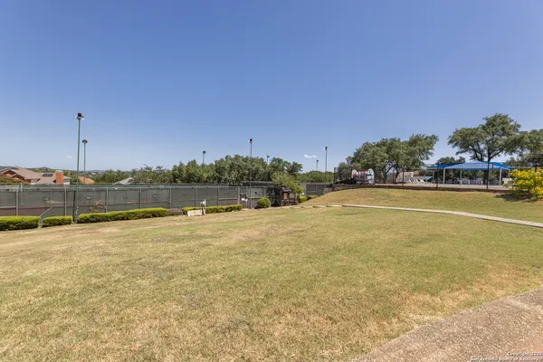 a view of a backyard of the house