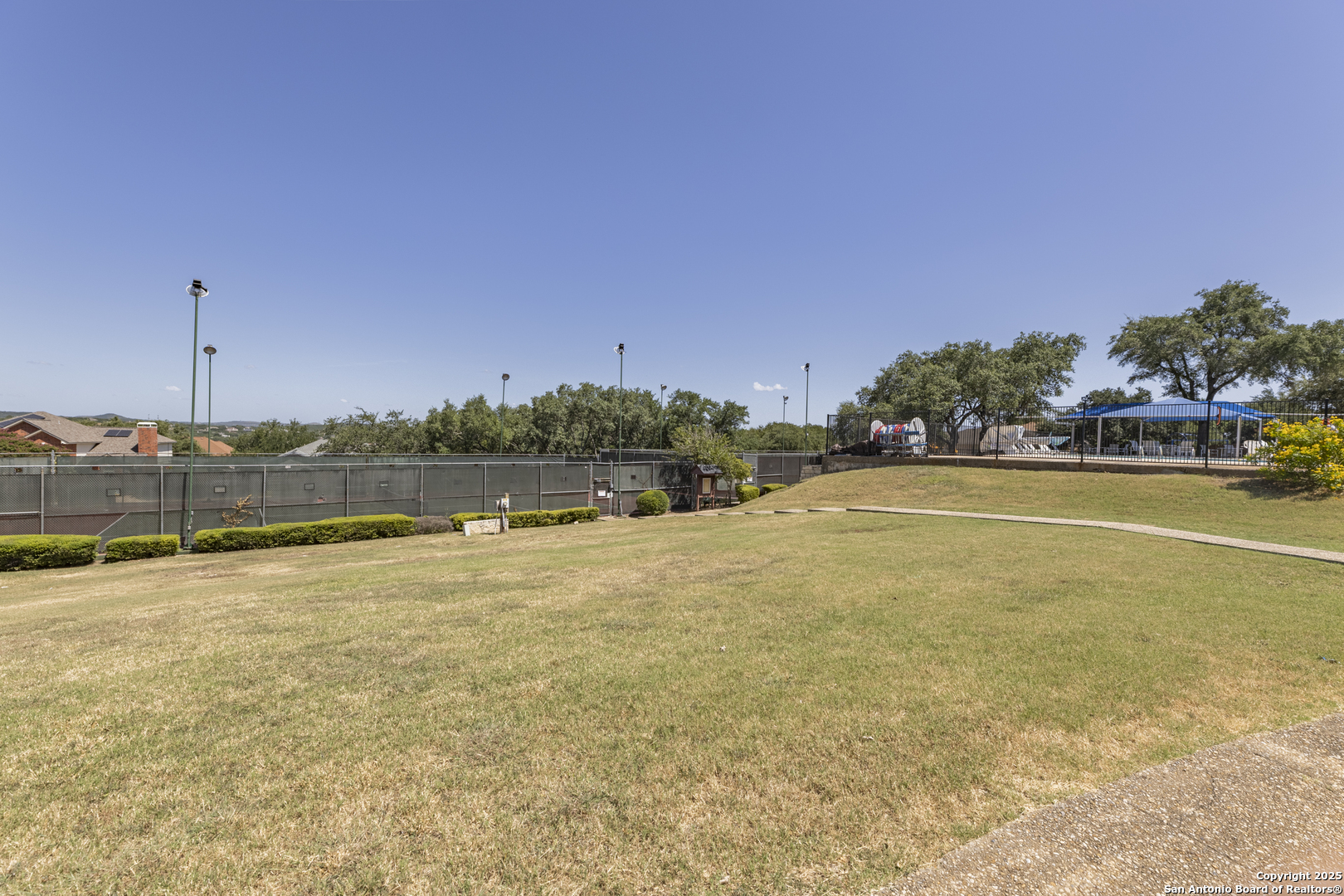 922 Hedgestone Drive San Antonio, TX 78258 - Photo 35 of 40 a view of a swimming pool and an outdoor seating