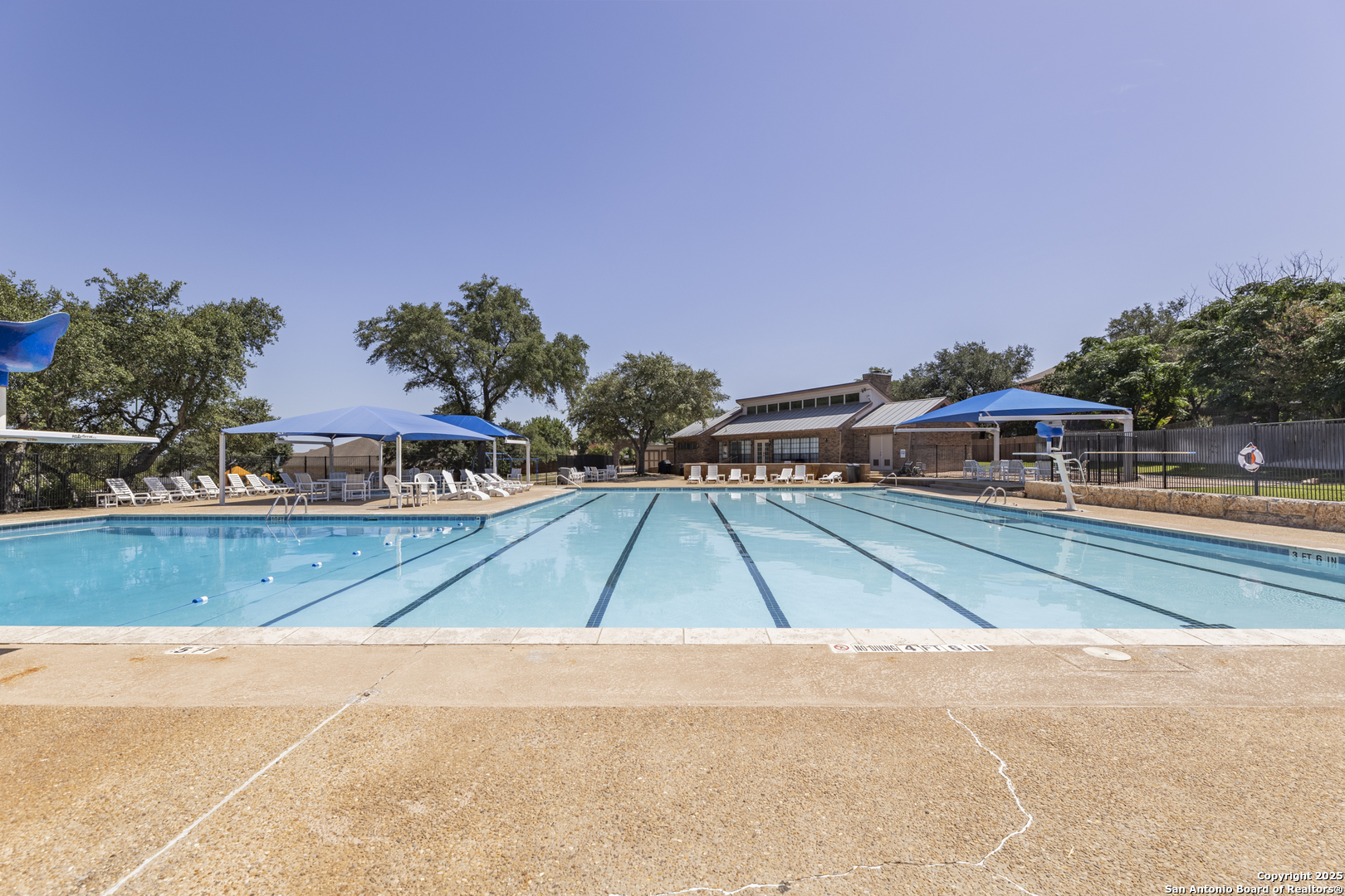922 Hedgestone Drive San Antonio, TX 78258 - Photo 40 of 40 a small pool with lawn chairs under an umbrella