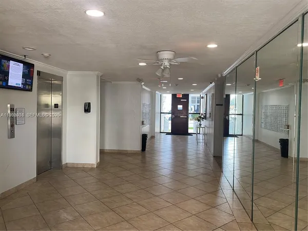 a view of a hallway with a kitchen