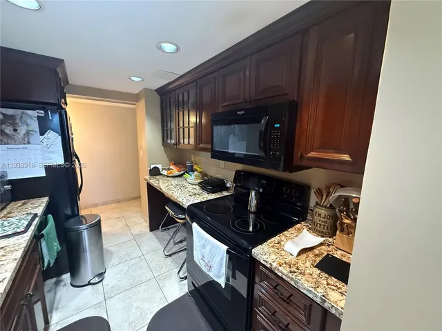 a kitchen with a stove and a microwave