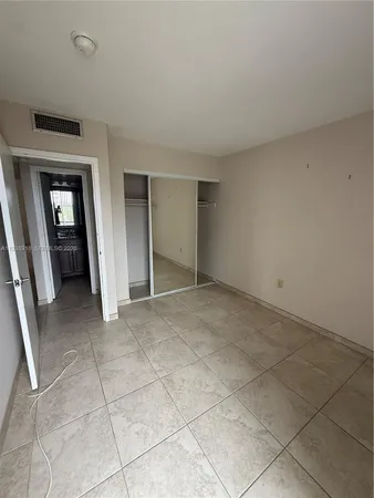 an empty room with a bathroom