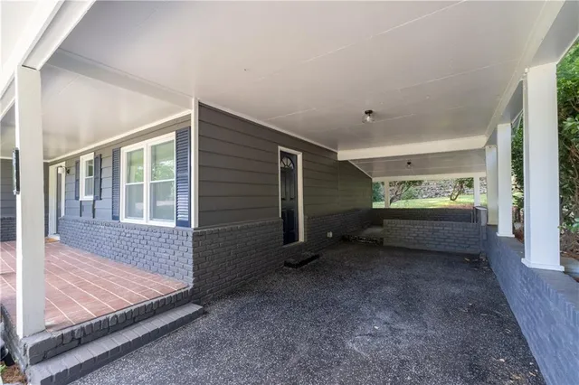 a view of room with window and entryway