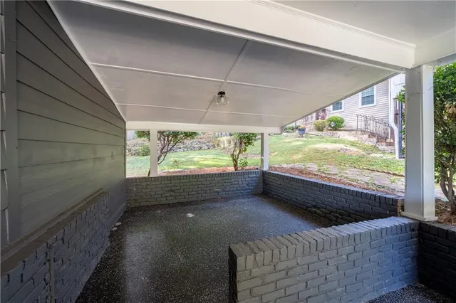 a room with furniture and a large window