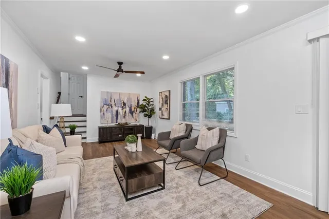 a living room with furniture and a large window