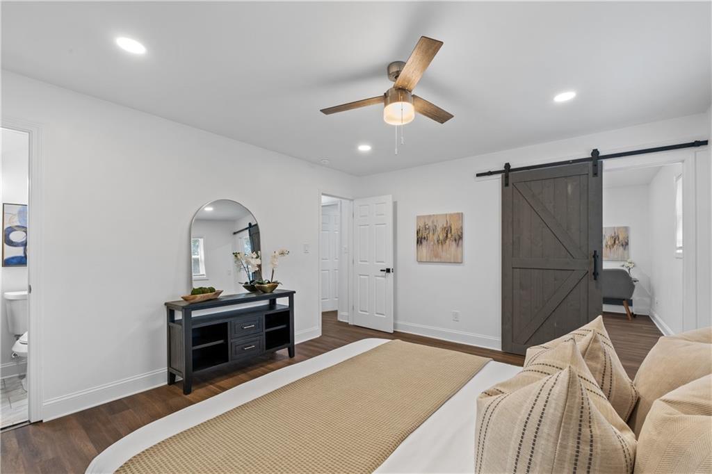 3144 Flamingo Drive East Point, GA 30344 - Photo 31 of 47 a bedroom with a bed and a chandelier