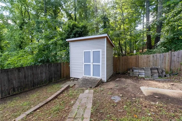 a backyard of a house with lots of green space