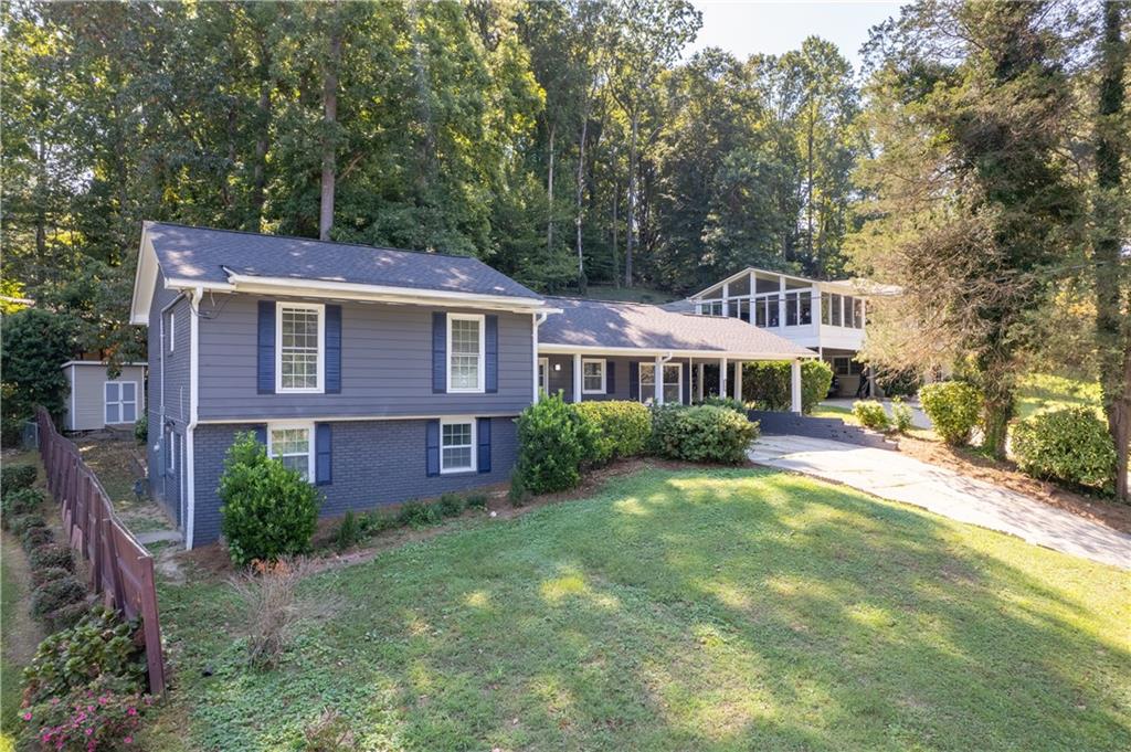 3144 Flamingo Drive East Point, GA 30344 - Photo 7 of 47 a front view of a house with yard and green space