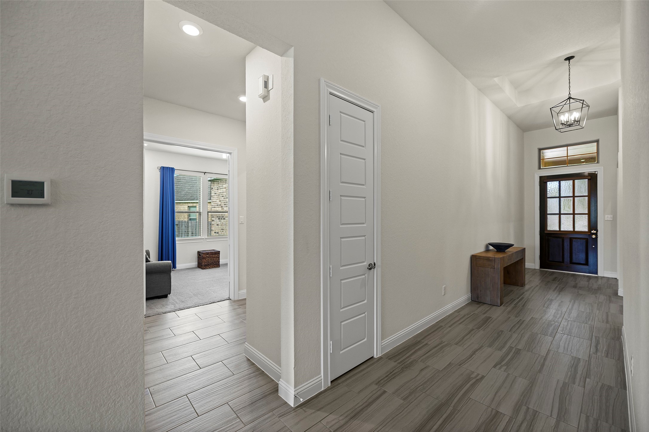 20330 Rosegold Way Spring, TX 77379 - Photo 36 of 48 Welcoming entry with soaring ceilings, durable tile flooring, and easy access to the private home office and secondary bedrooms.