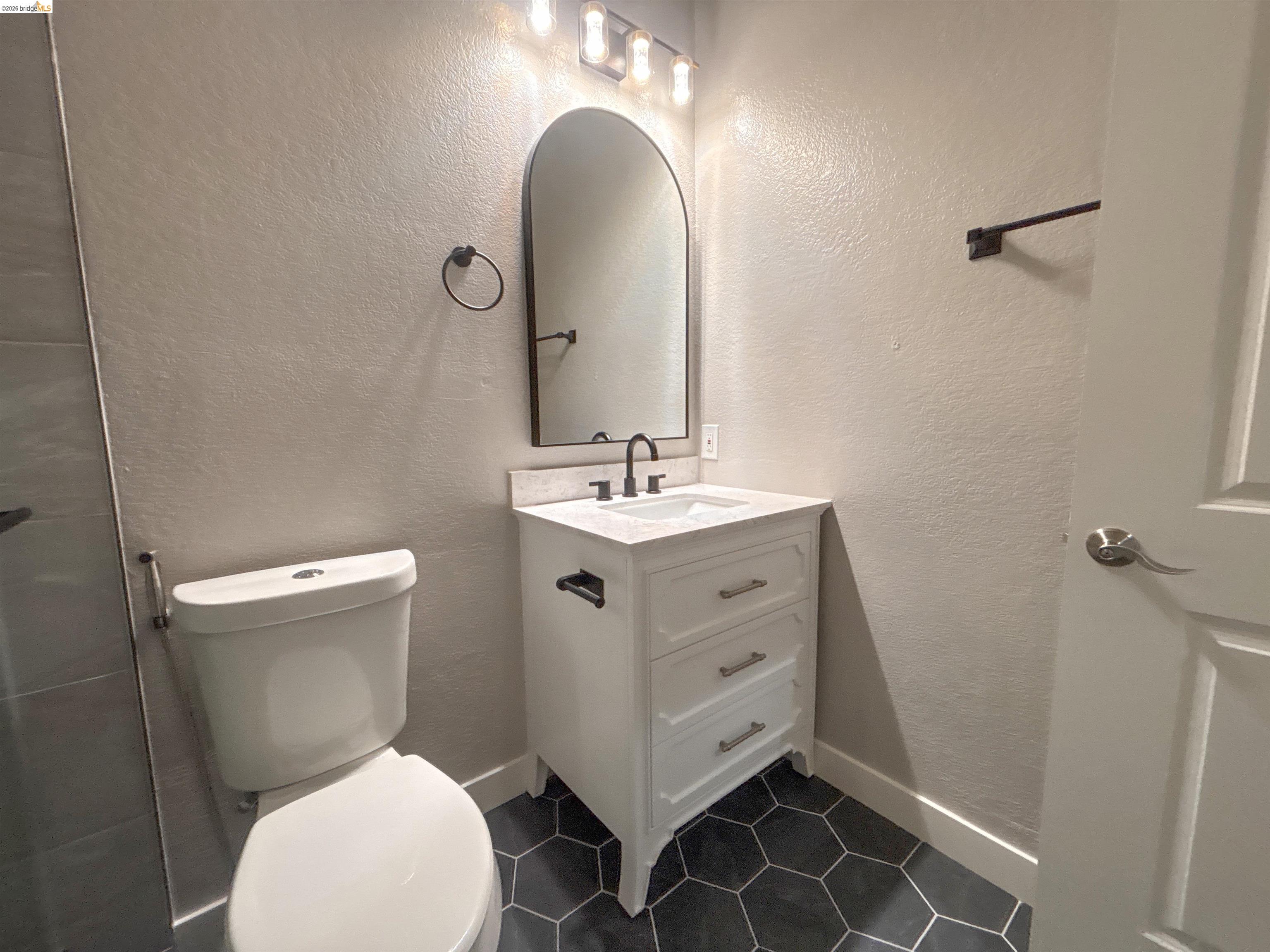 450 Pine Ridge Drive San Ramon, CA 94582 - Photo 12 of 18 a bathroom with a sink mirror vanity and toilet