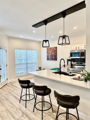 a kitchen with a table and chairs