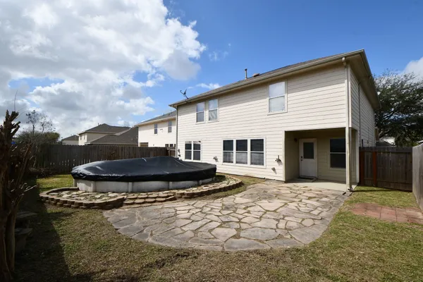 a house view with a garden space