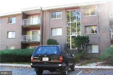 3802 Bel Pre Road, Unit 1428 Silver Spring, MD 20906 - Photo 2 of 2 a view of a brick house with a yard