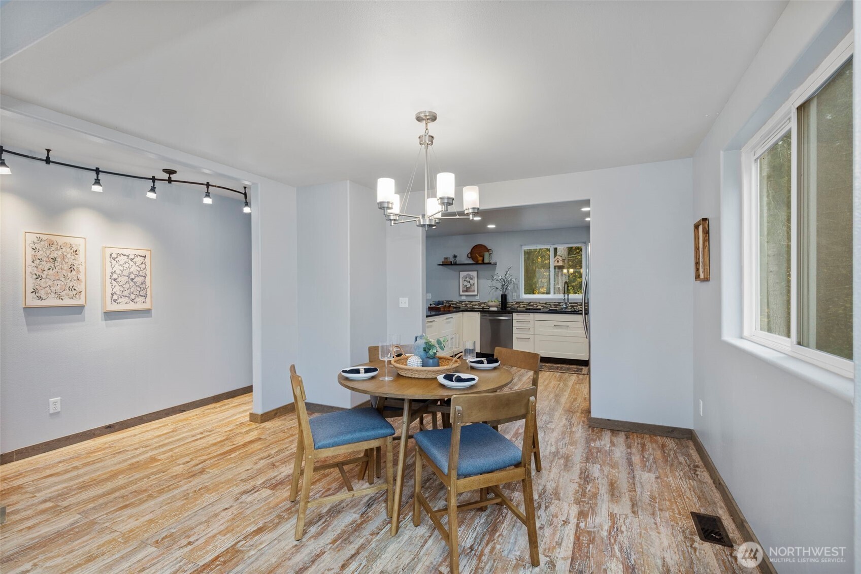 7506 353rd Street South Roy, WA 98580 - Photo 12 of 38 a dining room with furniture a chandelier and wooden floor